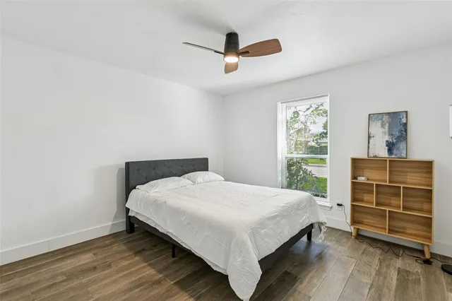 a bedroom with a bed and a dresser