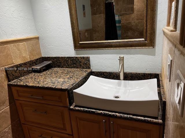 4751 Northwest 21st Street, Unit 605 Lauderhill, FL 33313 - Photo 5 of 12 a bath room with a sink and a mirror