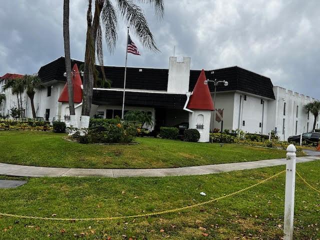 4751 Northwest 21st Street, Unit 605 Lauderhill, FL 33313 - Photo 9 of 12 a view of a house with a yard