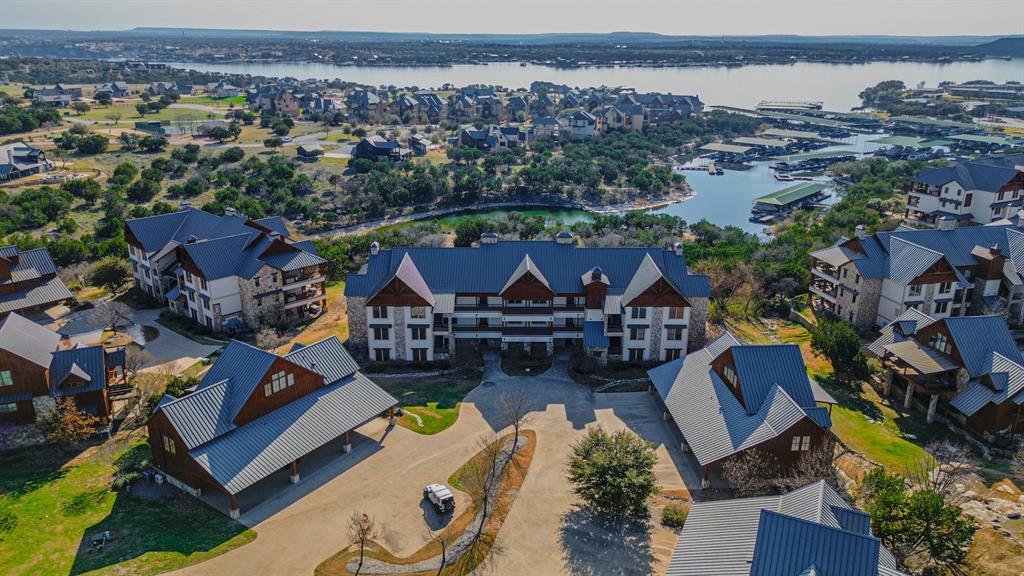 2033 Harbor Way, Unit 103 Graford, TX 76449 - Photo 1 of 22 an aerial view of multiple houses with yard