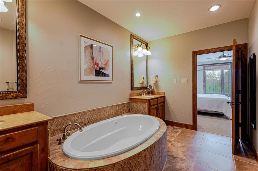 2033 Harbor Way, Unit 103 Graford, TX 76449 - Photo 12 of 22 a bathroom with a sink and a mirror