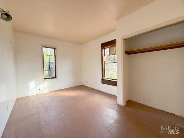 an empty room with windows
