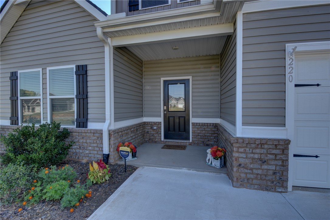 220 Clinkscales Road Anderson, SC 29624 - Photo 30 of 33 A welcoming covered porch and concrete walkway lead directly to the front entrance.