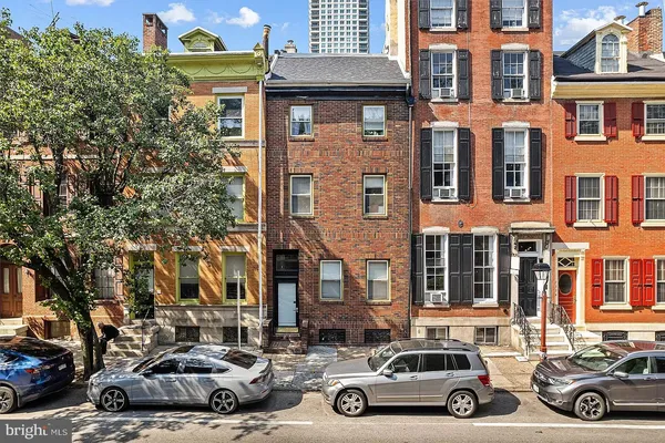 a view of a car parked in front of a houses