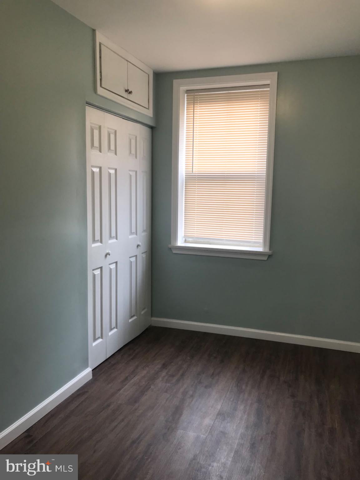 737 Spruce Street, Unit 3 Philadelphia, PA 19106 - Photo 11 of 15 an empty room with wooden floor and a window