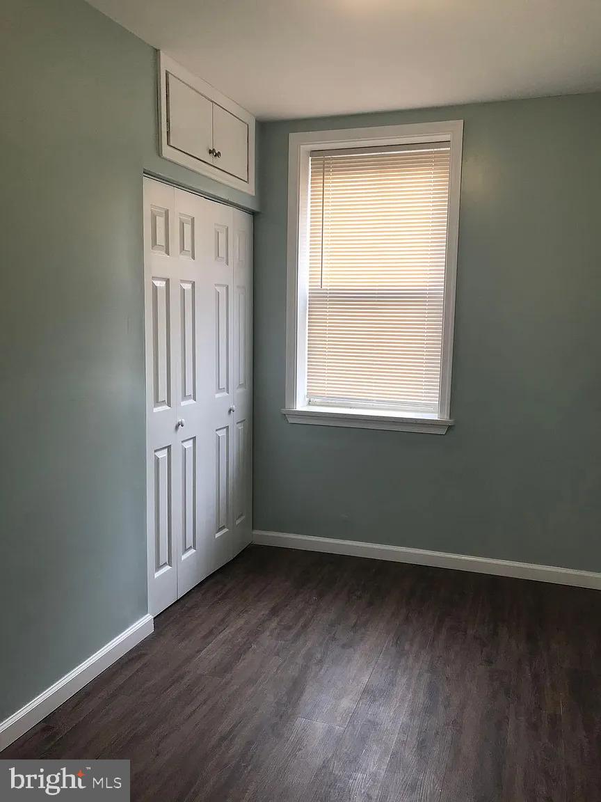 737 Spruce Street, Unit 3 Philadelphia, PA 19106 - Photo 12 of 15 an empty room with wooden floor and a window