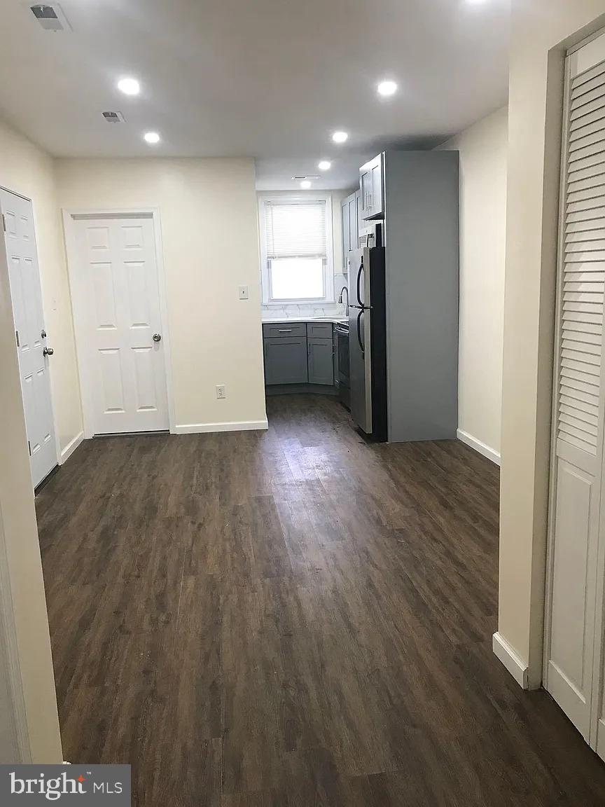 737 Spruce Street, Unit 3 Philadelphia, PA 19106 - Photo 4 of 15 an empty room with wooden floor and entrance