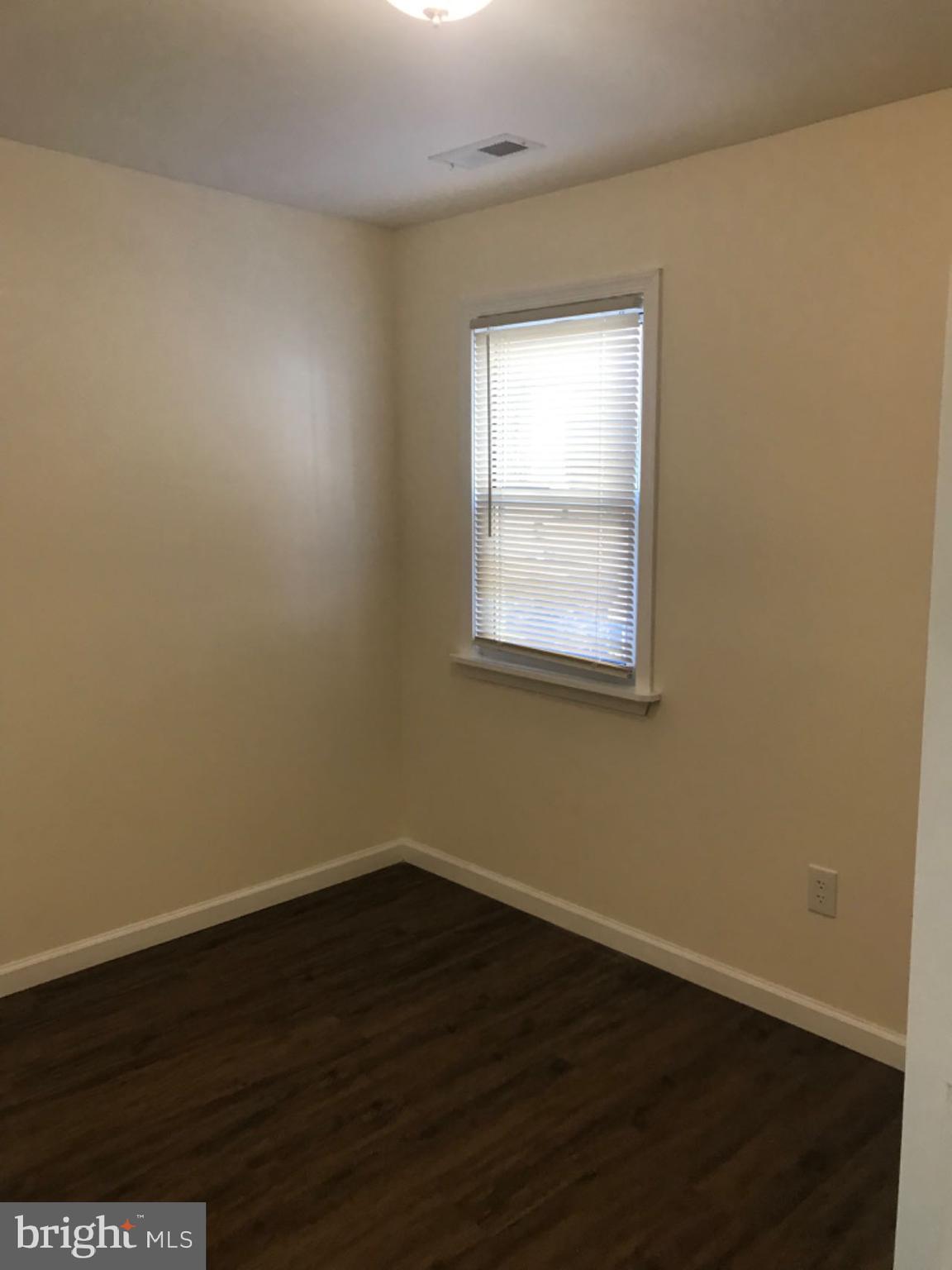 737 Spruce Street, Unit 3 Philadelphia, PA 19106 - Photo 9 of 15 a view of a small space with wooden floor and a window