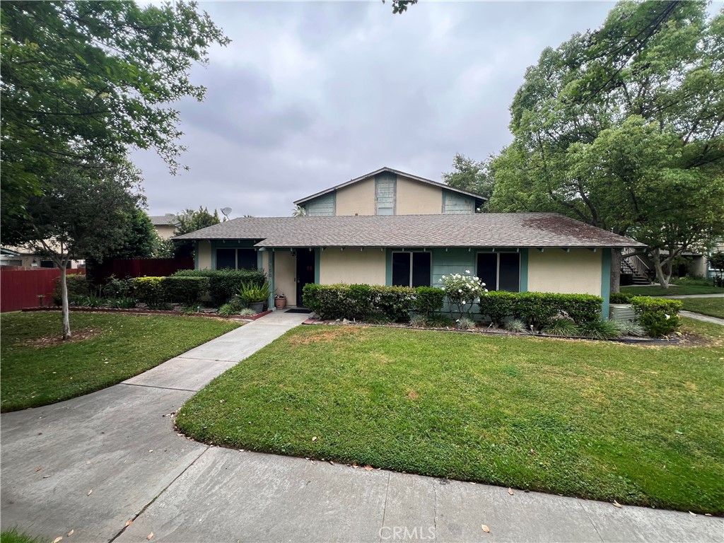 1356 Wheaton Way Riverside, CA 92507 - Photo 1 of 21 a front view of a house with a yard