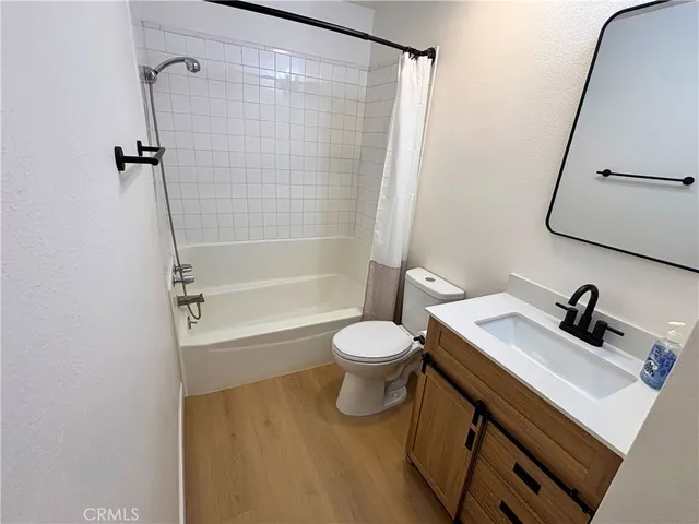 a bathroom with a sink a toilet and a tub