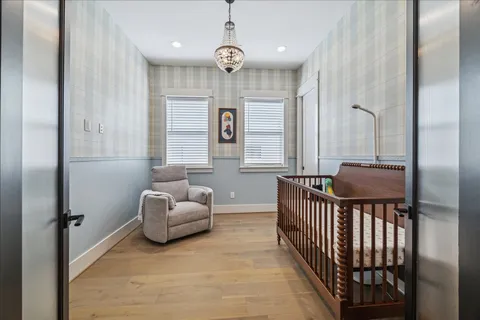 a bedroom with a large bed and a window