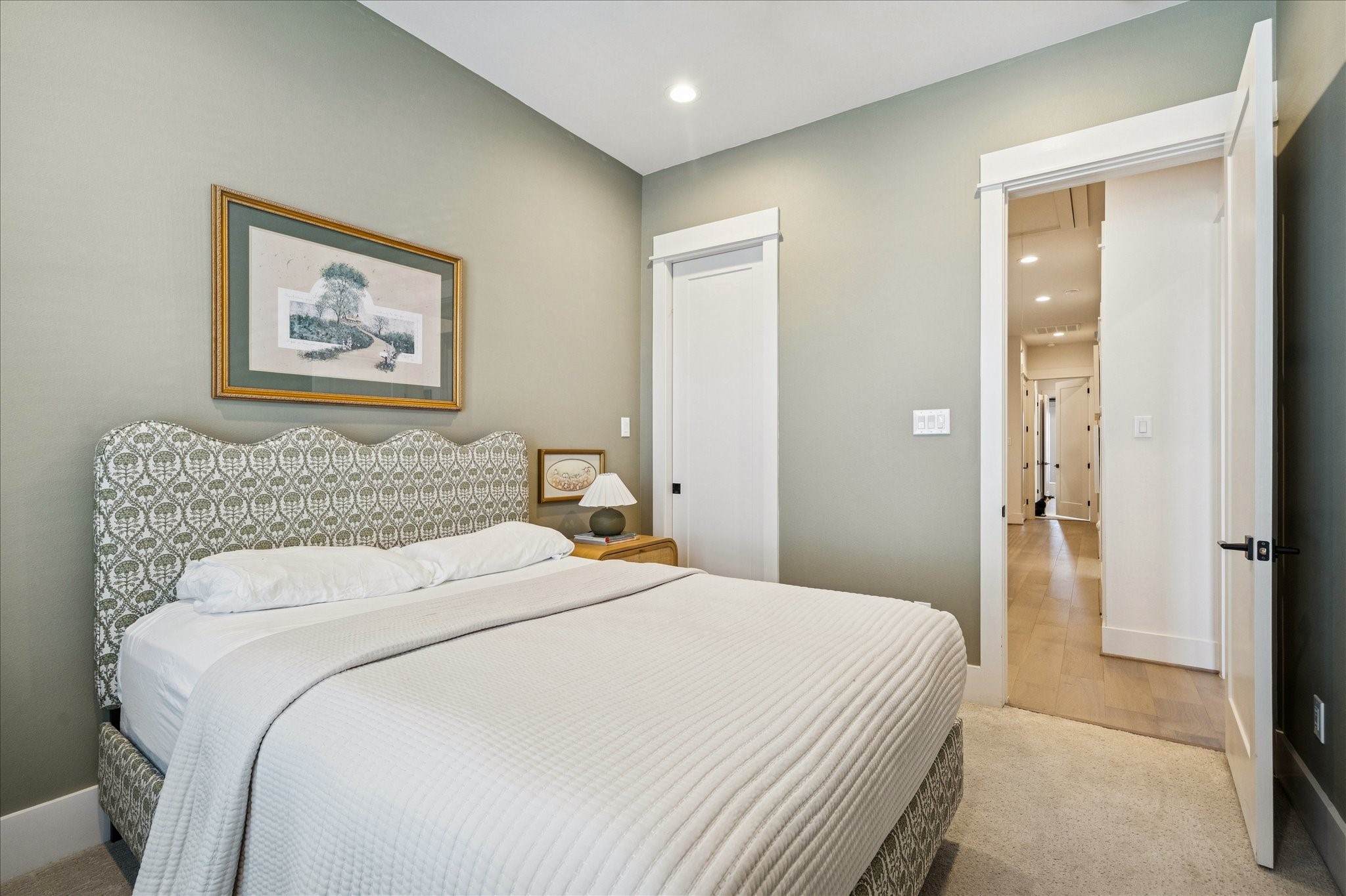 1311 Laird Street Houston, TX 77008 - Photo 17 of 29 a bedroom with a bed and a painting on the wall