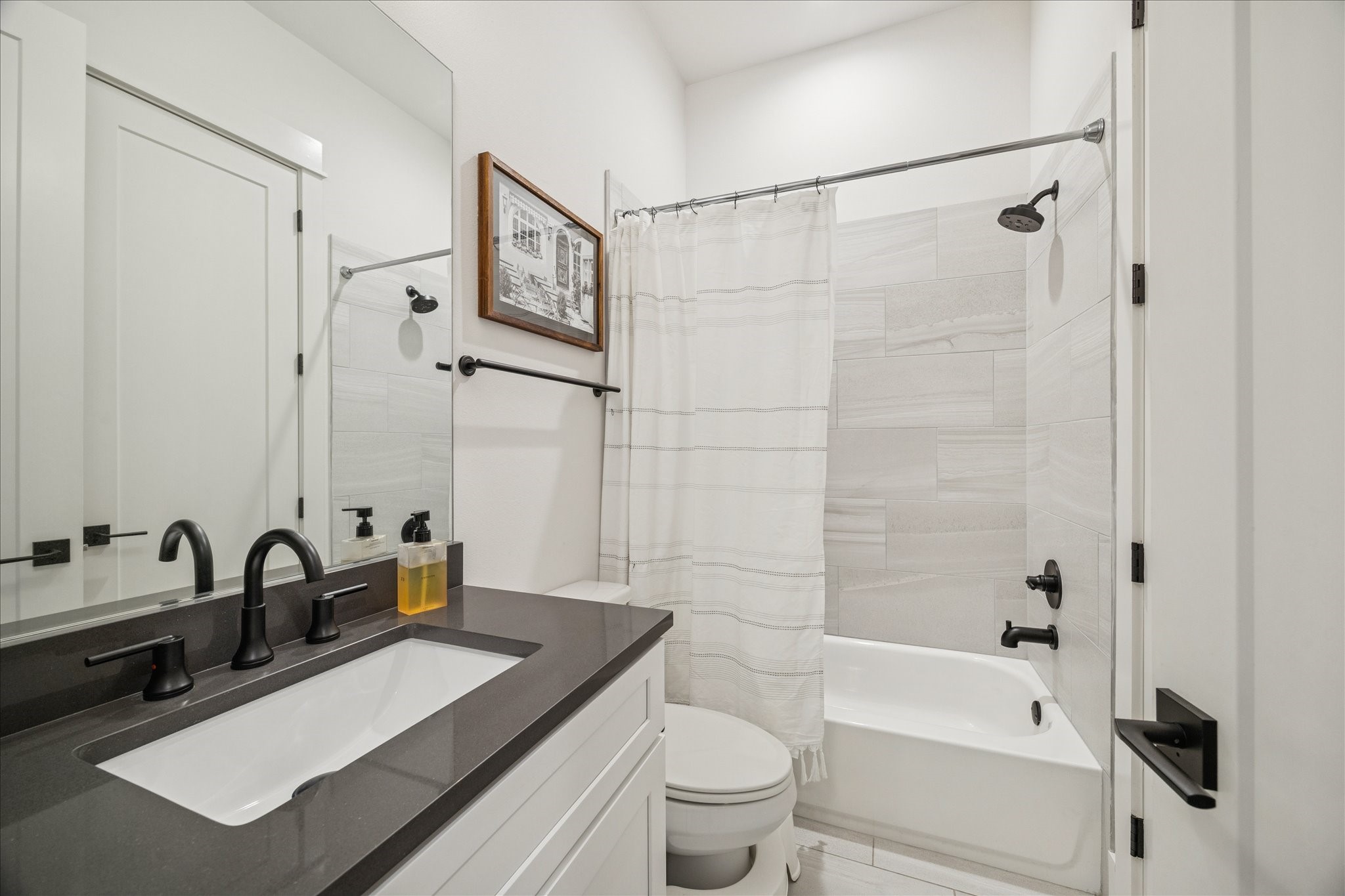 1311 Laird Street Houston, TX 77008 - Photo 20 of 29 a bathroom with a sink a toilet and a bathtub