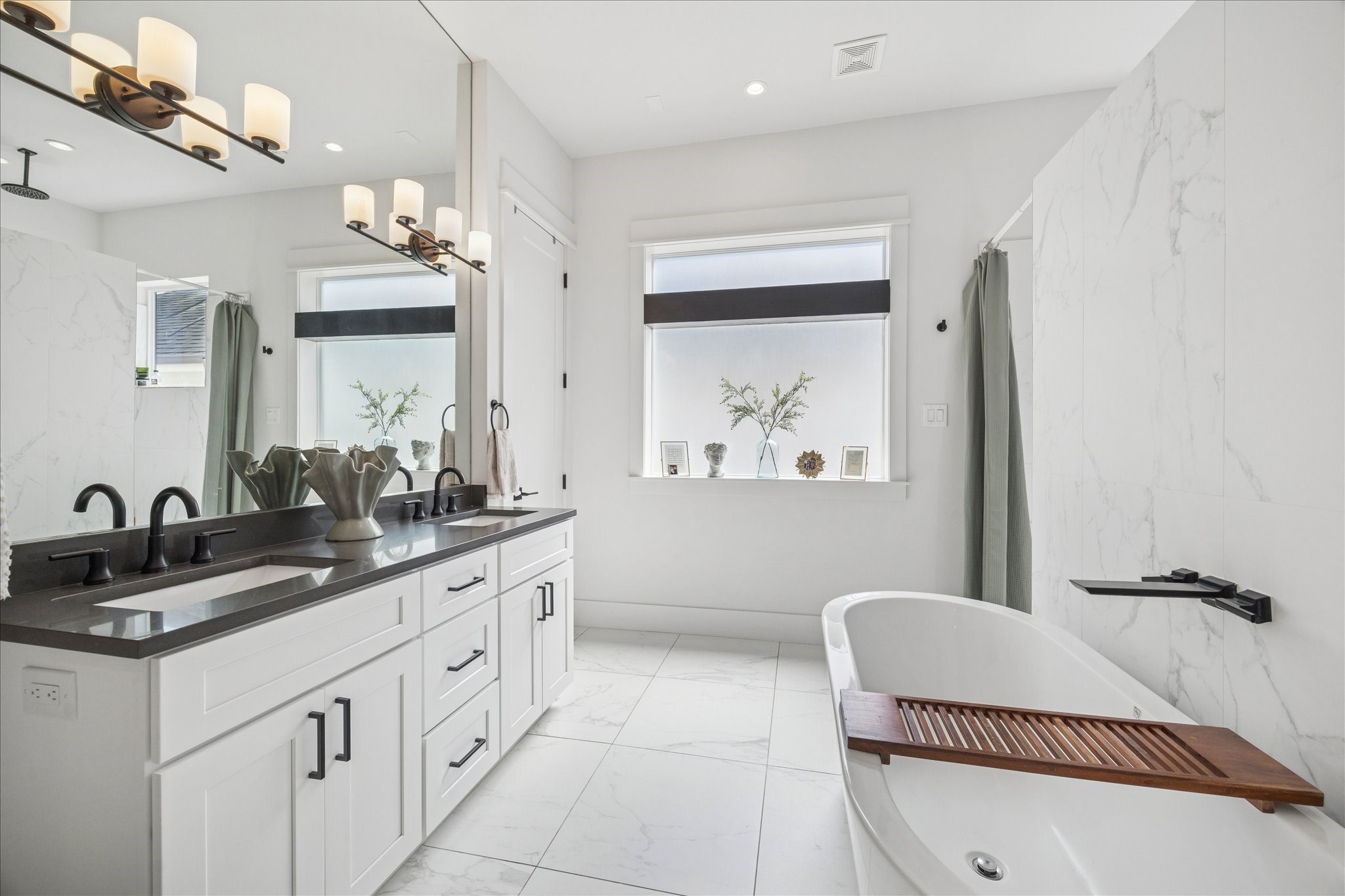 1311 Laird Street Houston, TX 77008 - Photo 24 of 29 a bathroom with a sink a toilet and a mirror