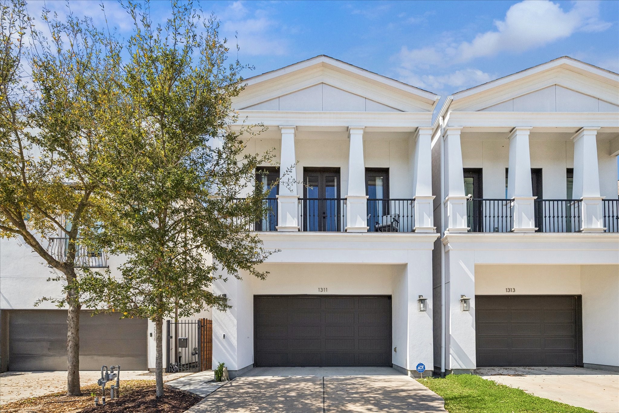 1311 Laird Street Houston, TX 77008 - Photo 3 of 29 a front view of a house with yard and parking