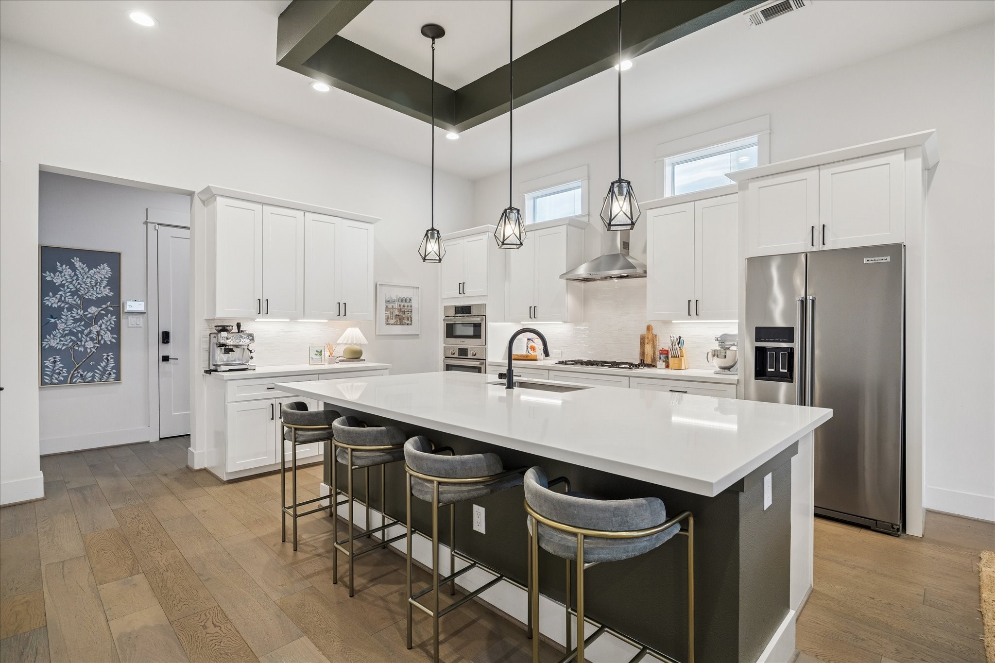 1311 Laird Street Houston, TX 77008 - Photo 5 of 29 a kitchen with stainless steel appliances a sink a stove a refrigerator and island