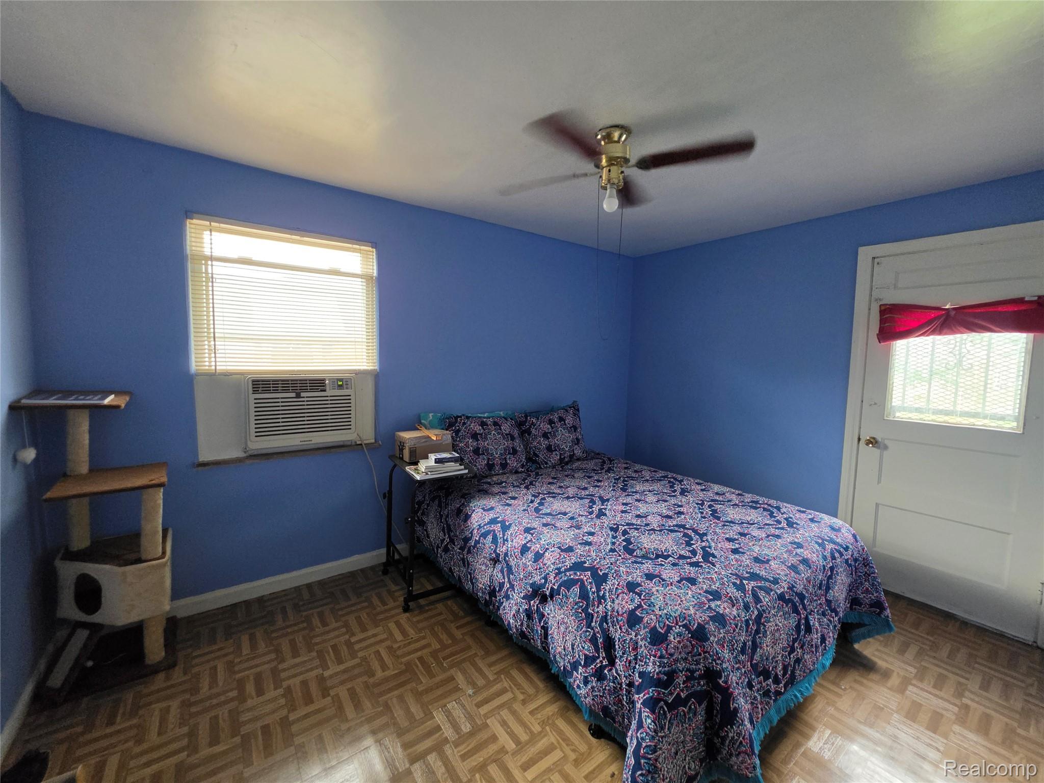 15832 Griggs Street Detroit, MI 48238 - Photo 17 of 24 Room featuring blue walls and parquet wood-finish flooring