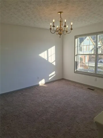 a view of a livingroom with a chandelier