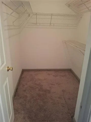 a view of a room with racks on the wall