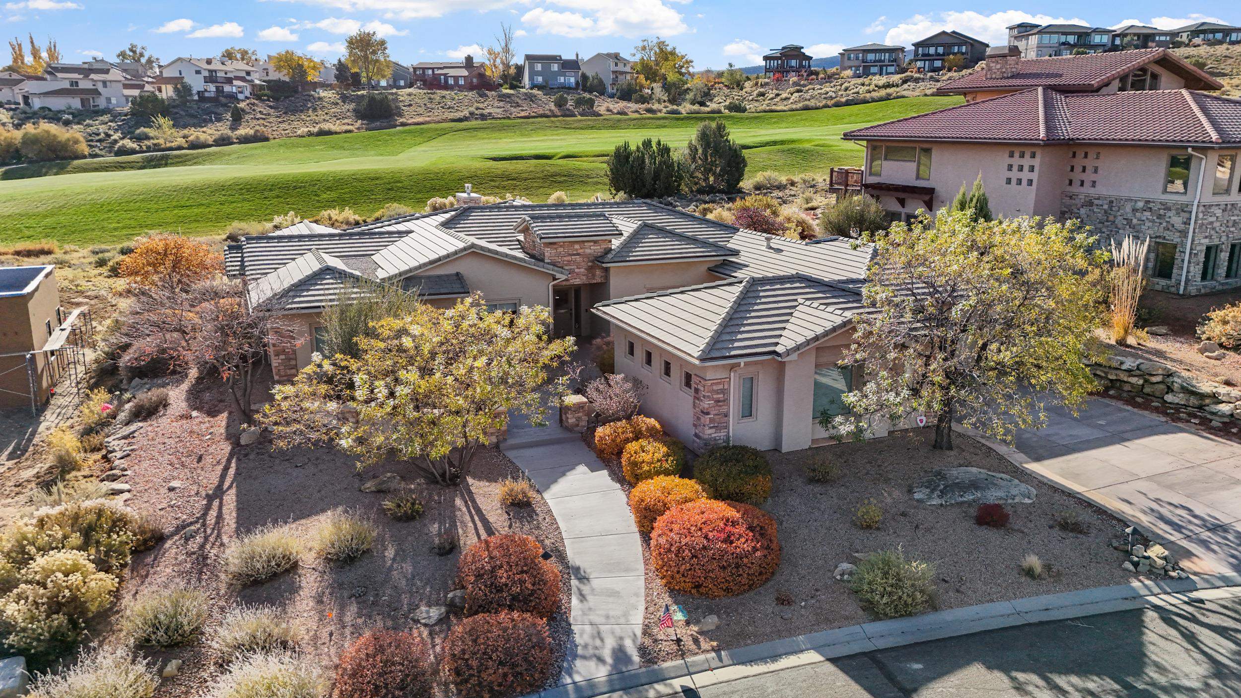 372 High Desert Road Grand Junction, CO 81507 - Photo 1 of 40 an aerial view of a house with garden space and ocean view