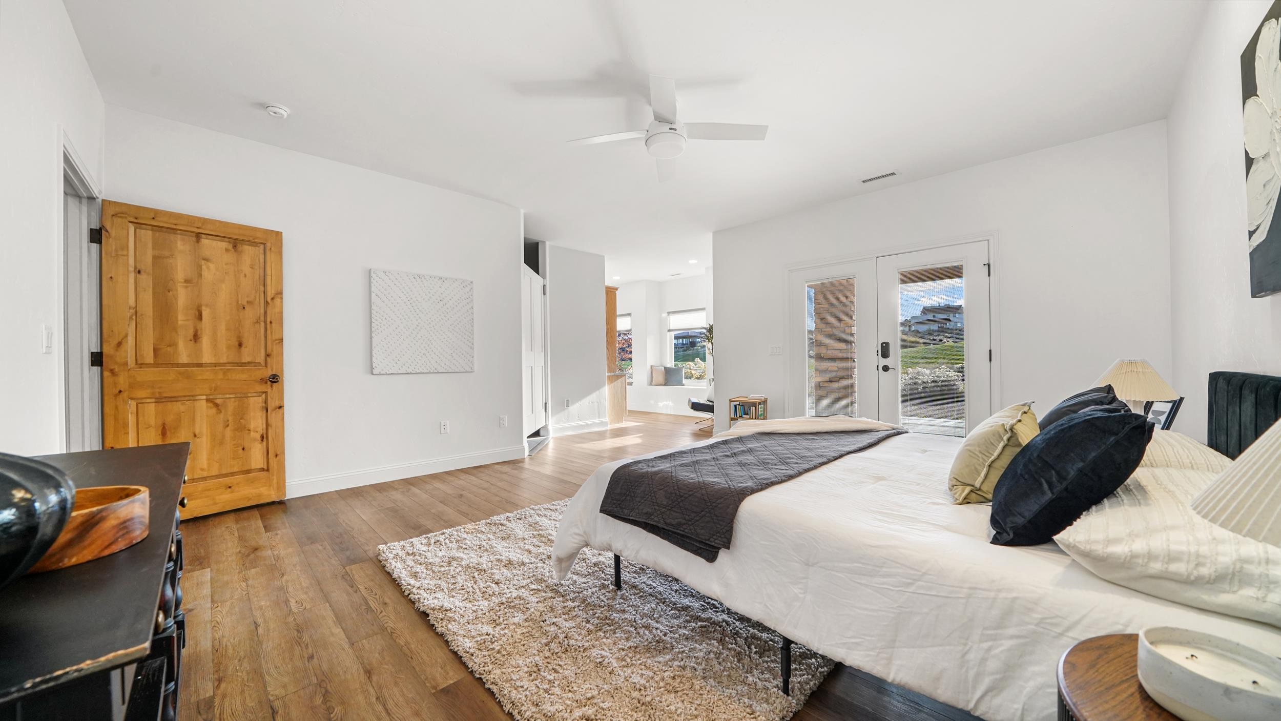 372 High Desert Road Grand Junction, CO 81507 - Photo 12 of 40 a bedroom with a bed and wooden floor