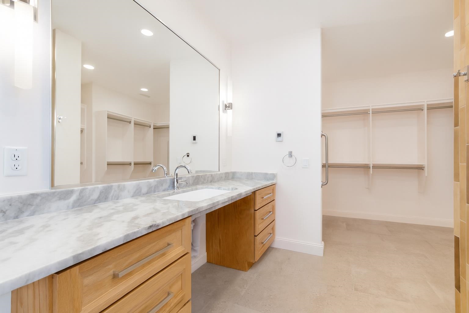 372 High Desert Road Grand Junction, CO 81507 - Photo 15 of 40 a bathroom with a granite countertop sink and a mirror