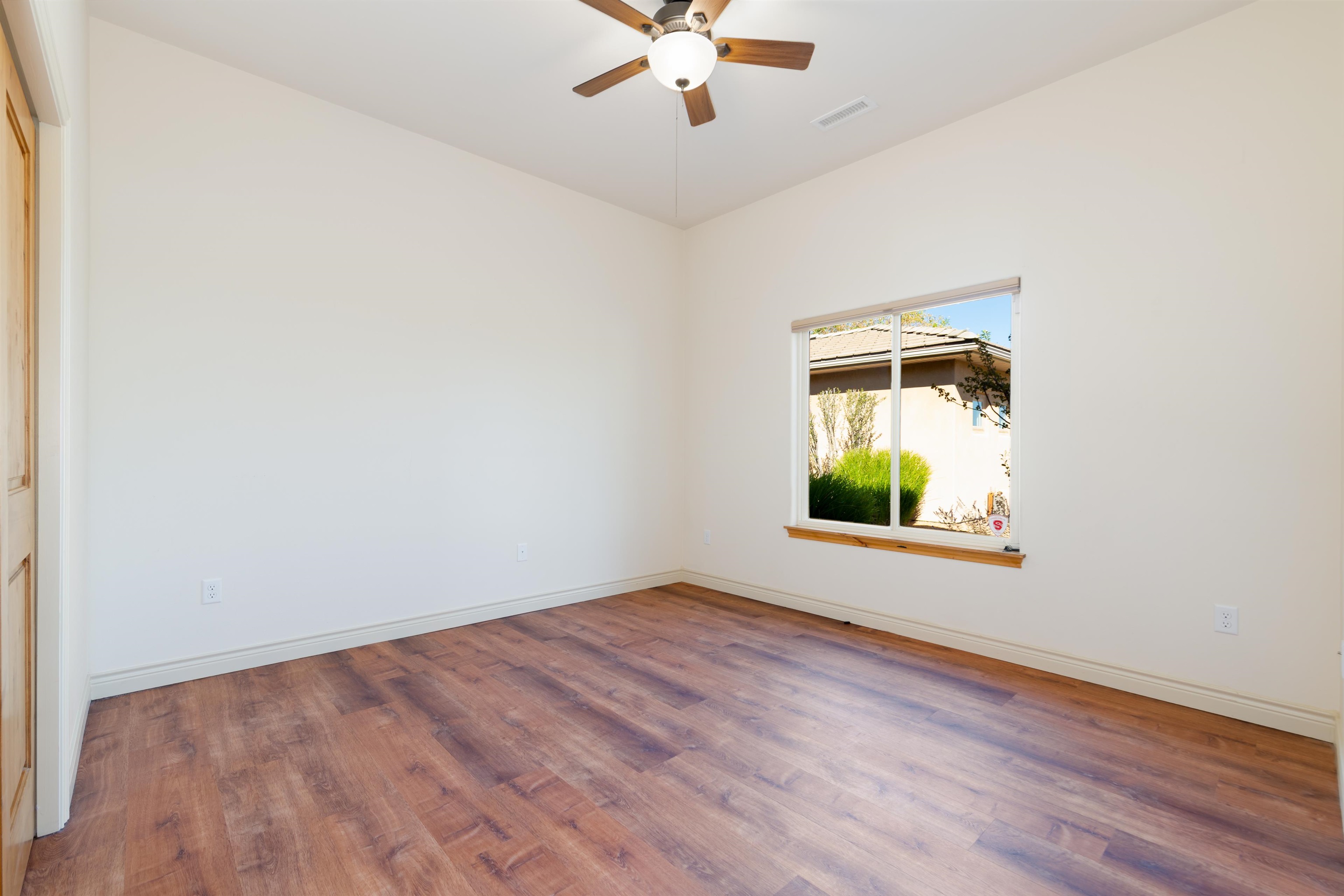 372 High Desert Road Grand Junction, CO 81507 - Photo 18 of 40 an empty room with window and a ceiling fan