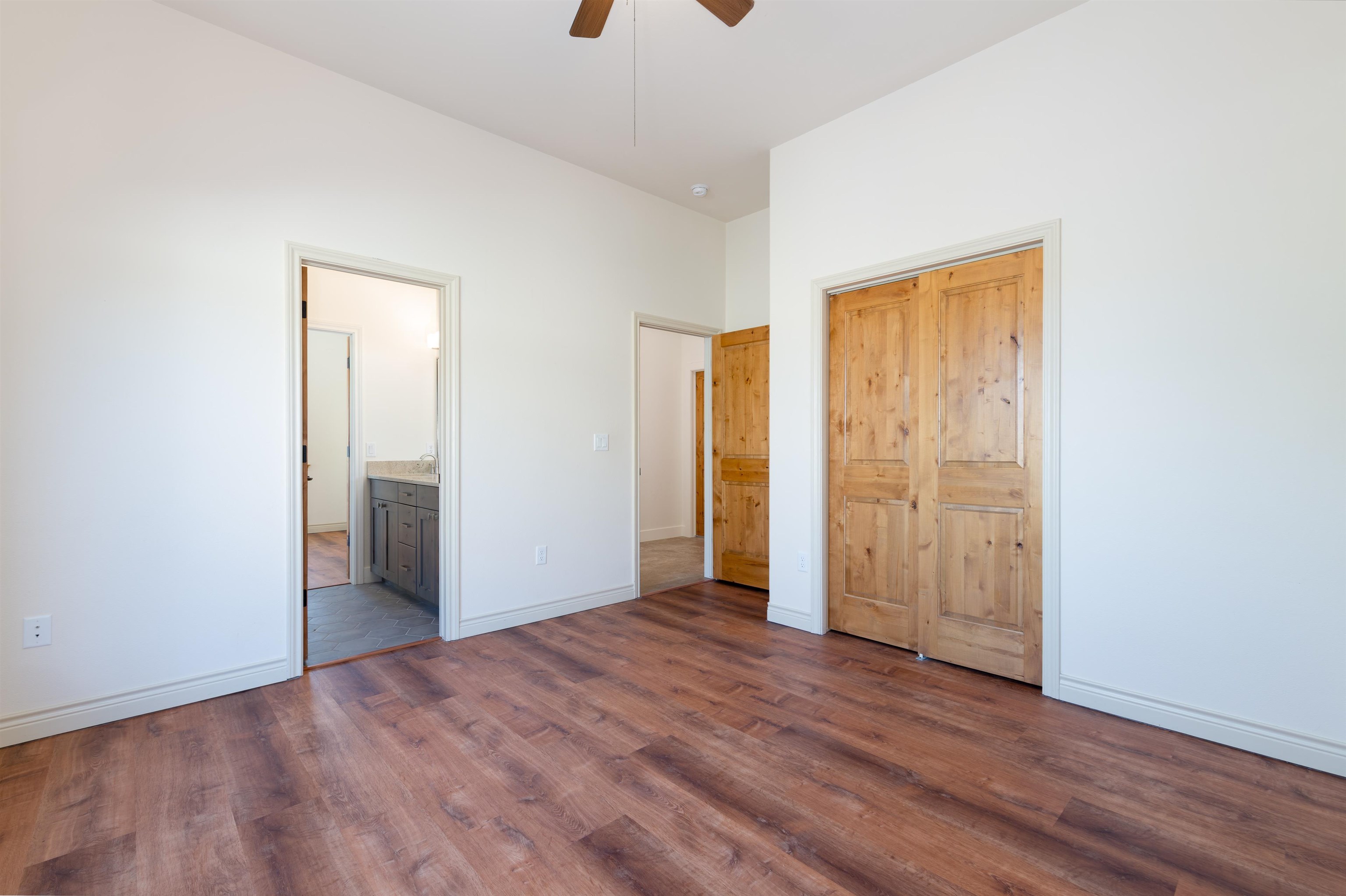 372 High Desert Road Grand Junction, CO 81507 - Photo 19 of 40 an empty room with wooden floor and closet