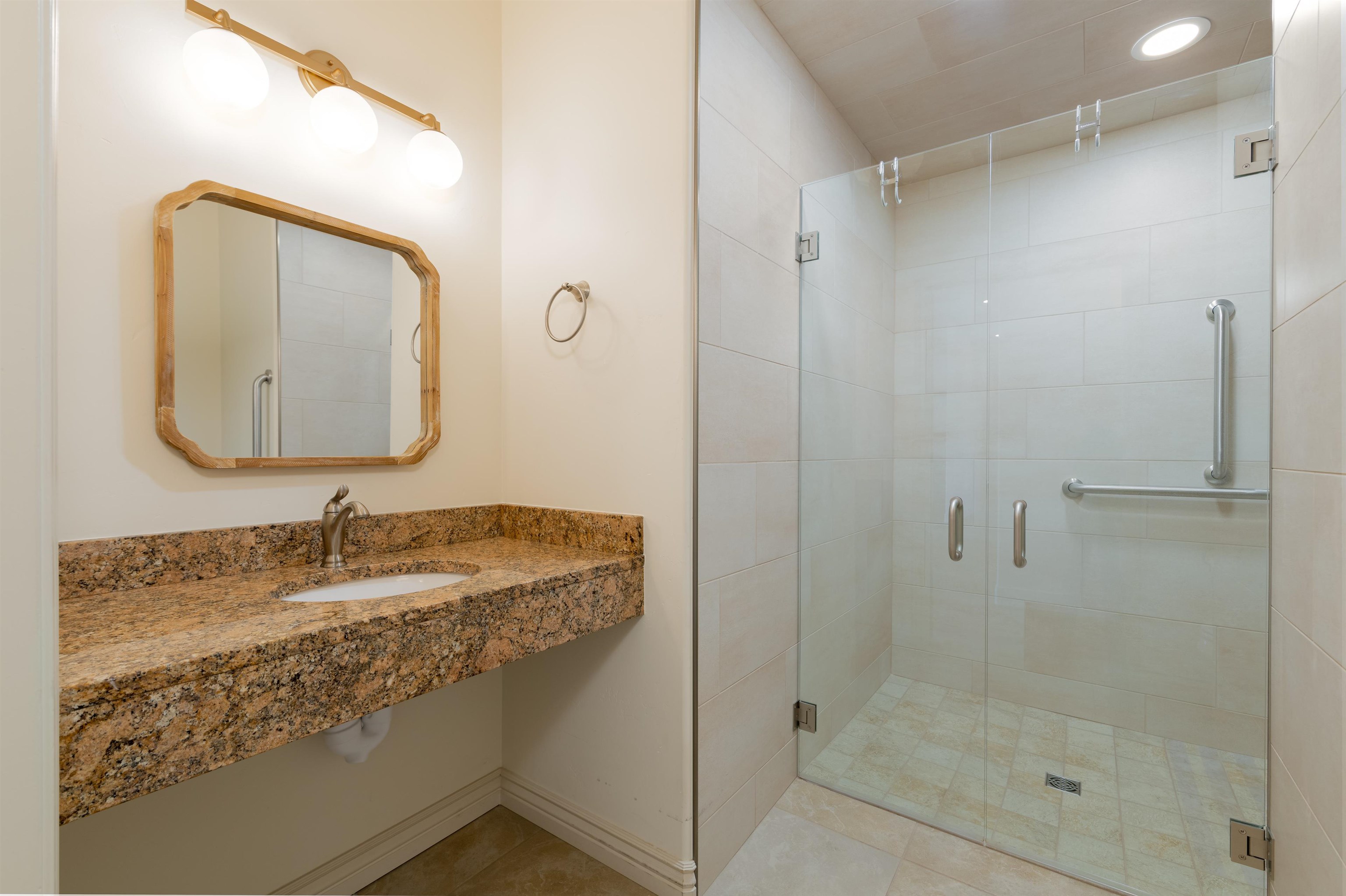 372 High Desert Road Grand Junction, CO 81507 - Photo 23 of 40 a bathroom with a granite countertop sink mirror and shower