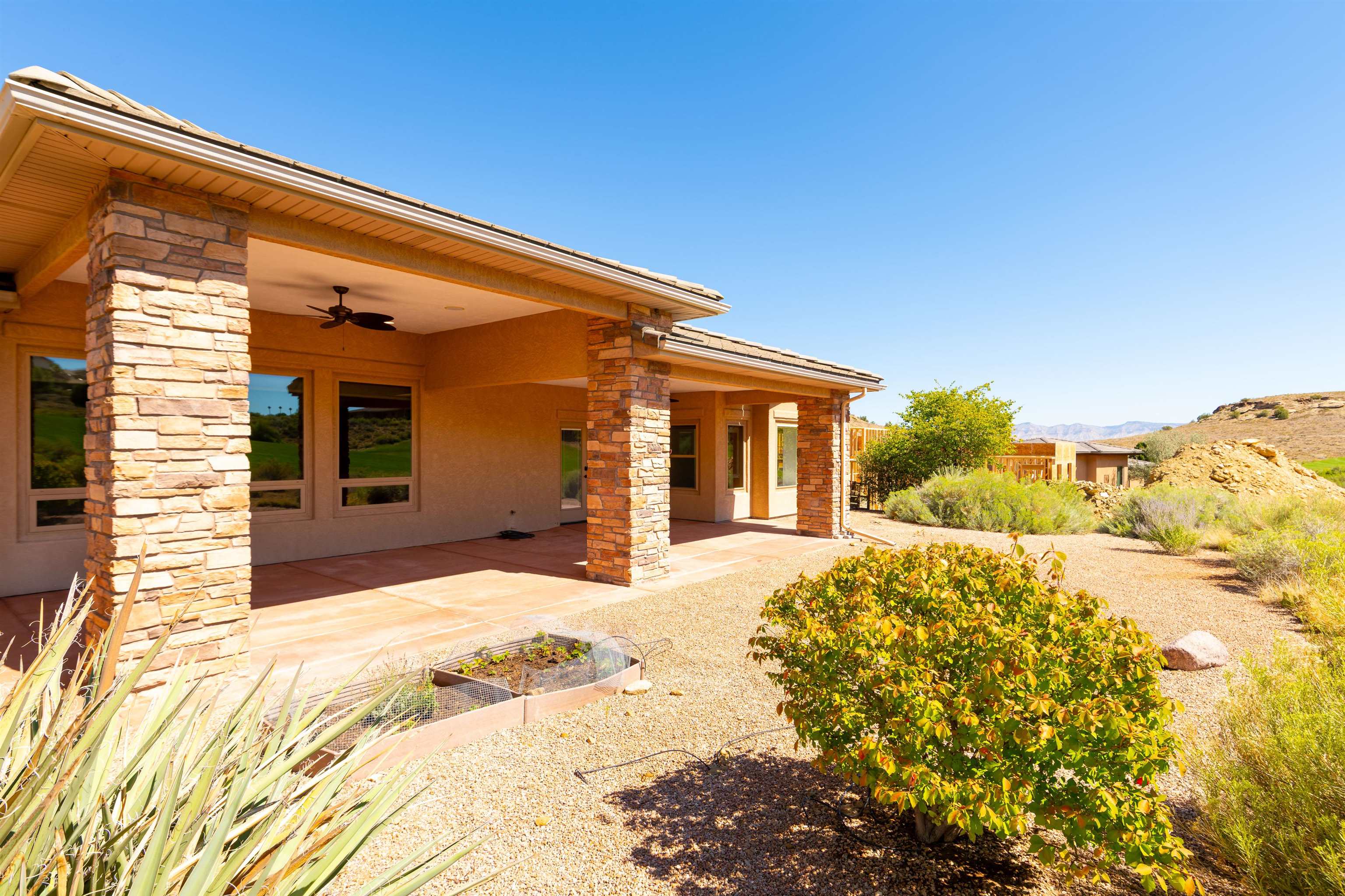372 High Desert Road Grand Junction, CO 81507 - Photo 29 of 40 a front view of a house with a yard