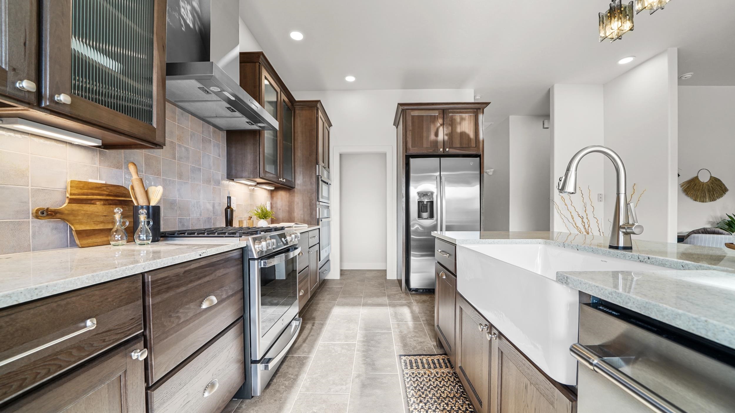 372 High Desert Road Grand Junction, CO 81507 - Photo 7 of 40 a kitchen with stainless steel appliances granite countertop lots of counter top space and wooden floor