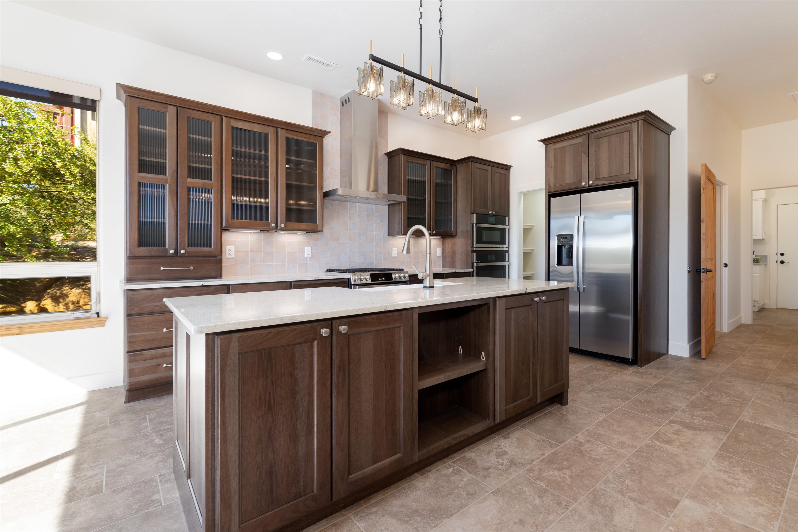372 High Desert Road Grand Junction, CO 81507 - Photo 9 of 40 a kitchen with stainless steel appliances granite countertop a stove a refrigerator and a sink