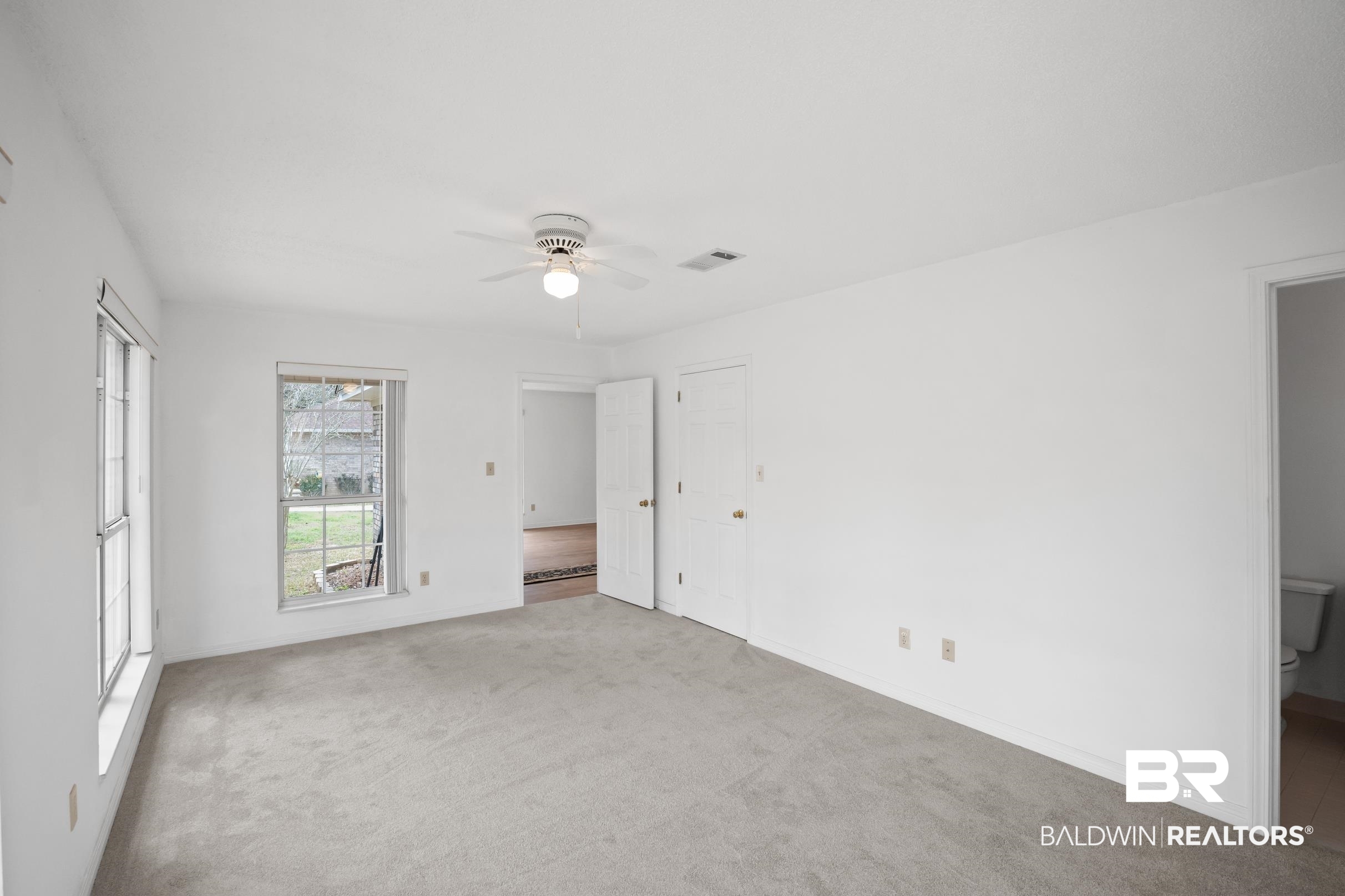 2673 Pine Ridge Drive Lillian, AL 36549 - Photo 18 of 38 Unfurnished bedroom with carpet flooring, visible vents, baseboards, and ceiling fan