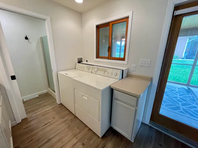 a utility room with a sink a washer and dryer