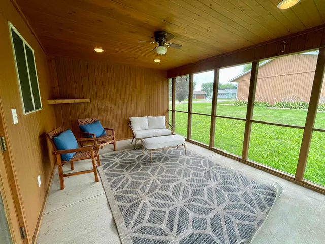 a bed sitting in a room next to a window