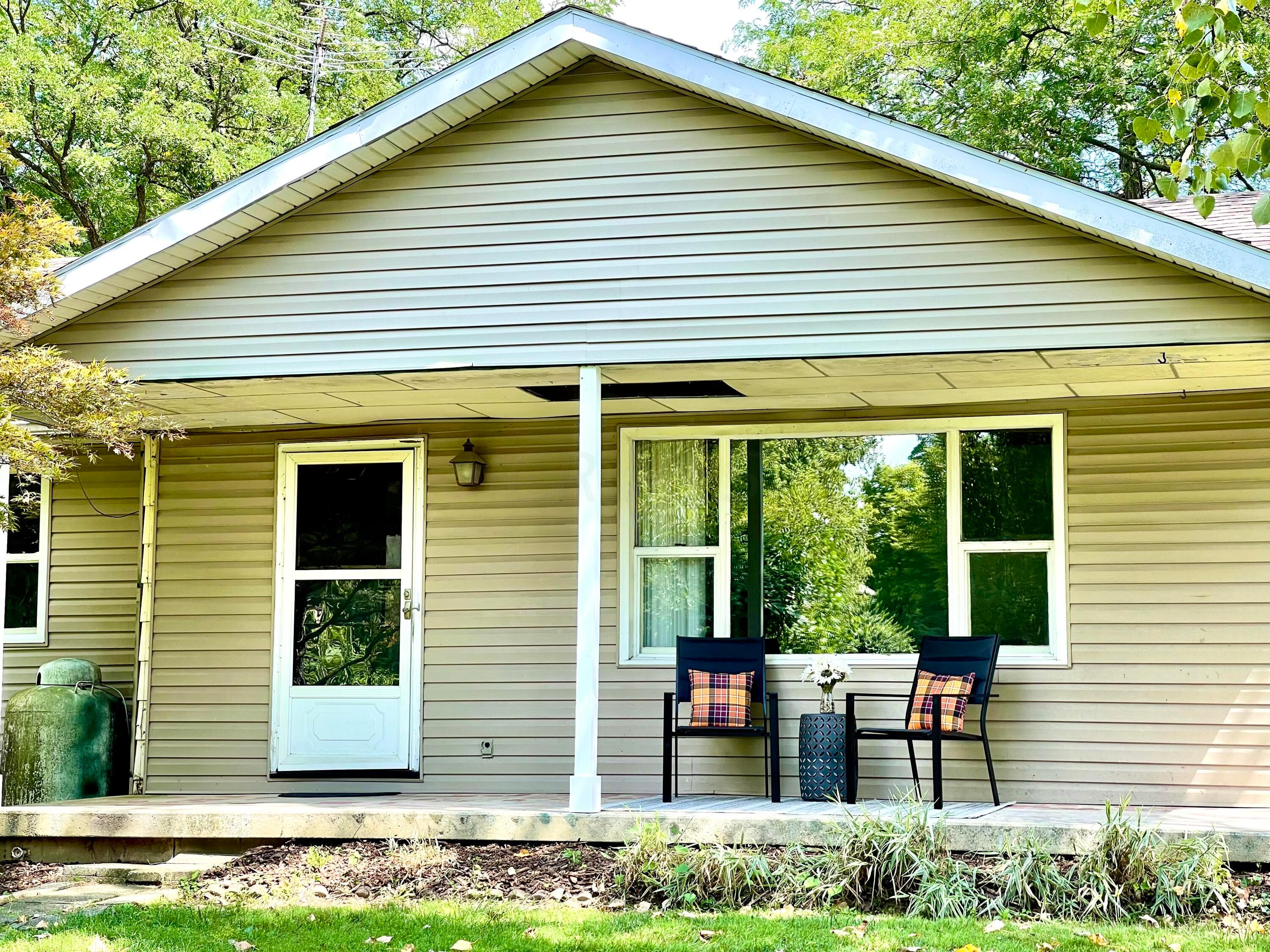 10671 Co Road East Liberty, OH 43319 - Photo 11 of 37 Front porch with southern exposure and shady trees
