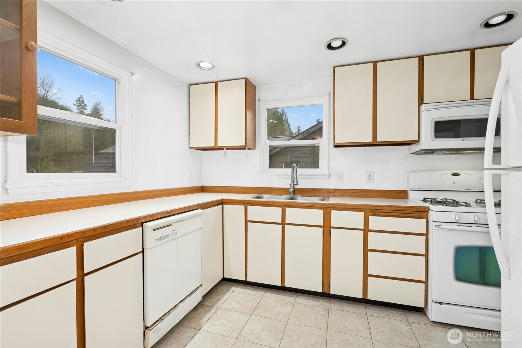 3125 Southeast 6th Street Renton, WA 98058 - Photo 12 of 27 a kitchen with a sink and a stove top oven