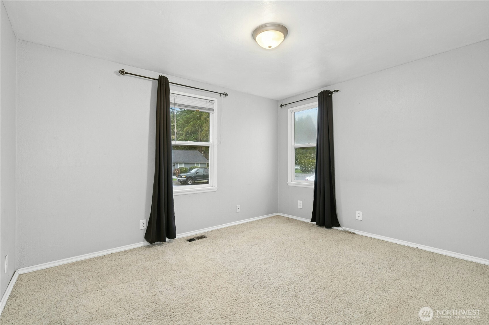 3125 Southeast 6th Street Renton, WA 98058 - Photo 18 of 27 an empty room with windows and closet