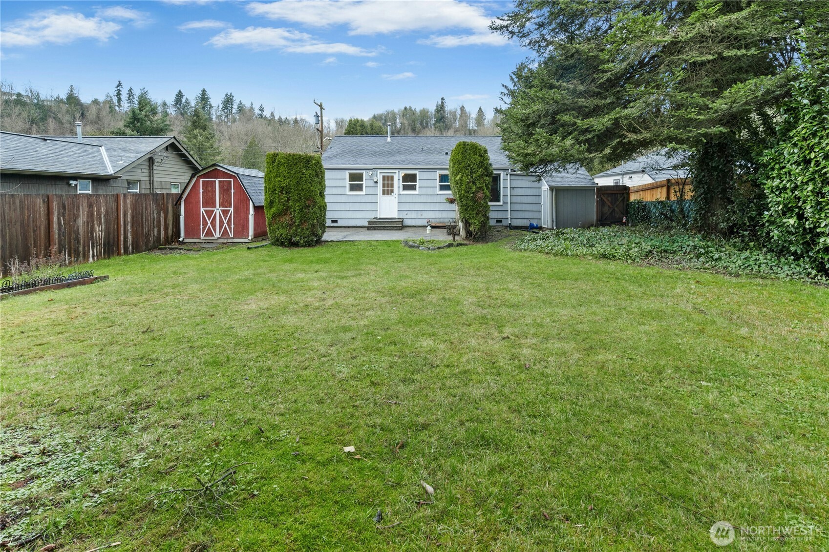 3125 Southeast 6th Street Renton, WA 98058 - Photo 26 of 27 a view of a house with backyard and a tree