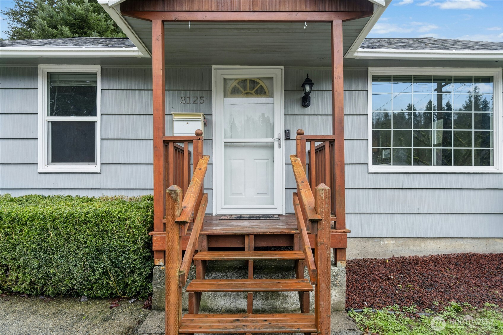 3125 Southeast 6th Street Renton, WA 98058 - Photo 4 of 27 a front view of a house with a large windows