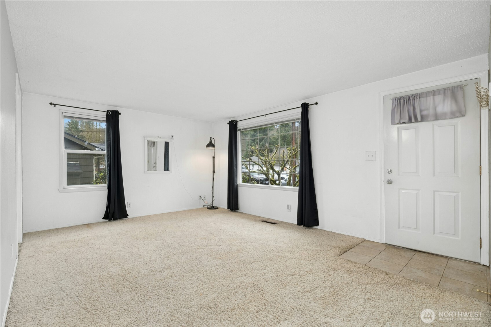 3125 Southeast 6th Street Renton, WA 98058 - Photo 6 of 27 a view of an empty room with a window