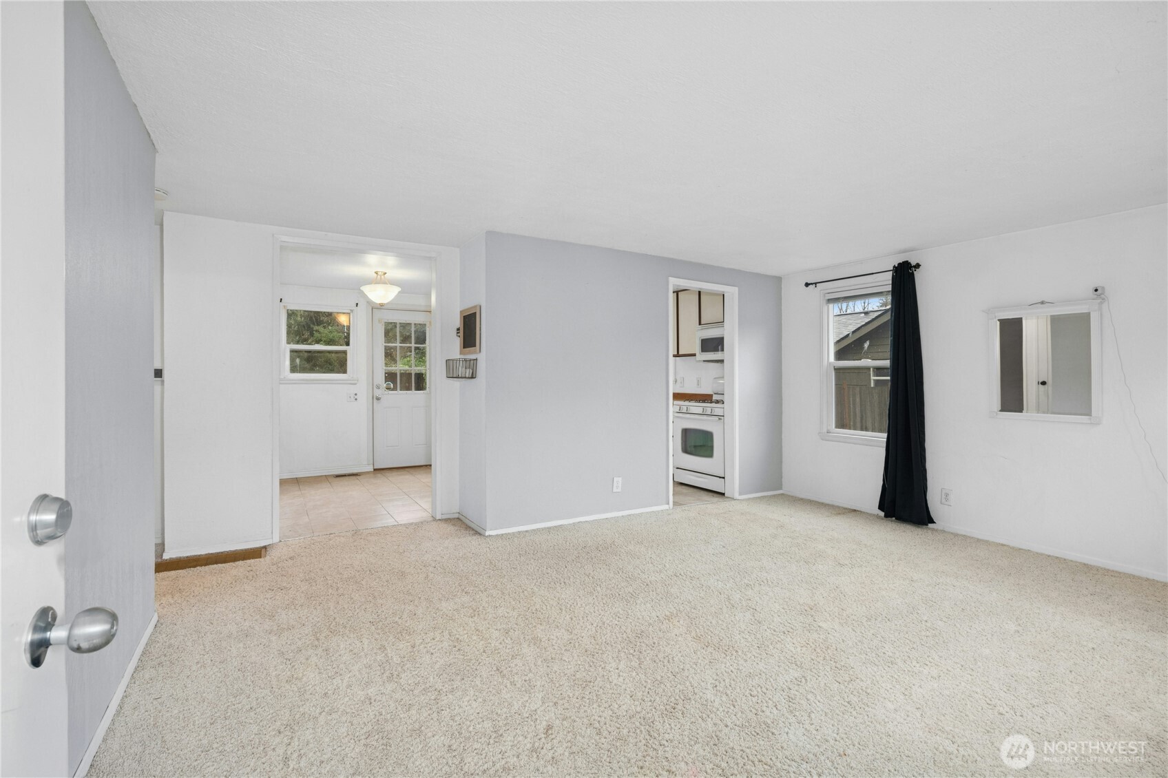 3125 Southeast 6th Street Renton, WA 98058 - Photo 7 of 27 an empty room with closet and mirror