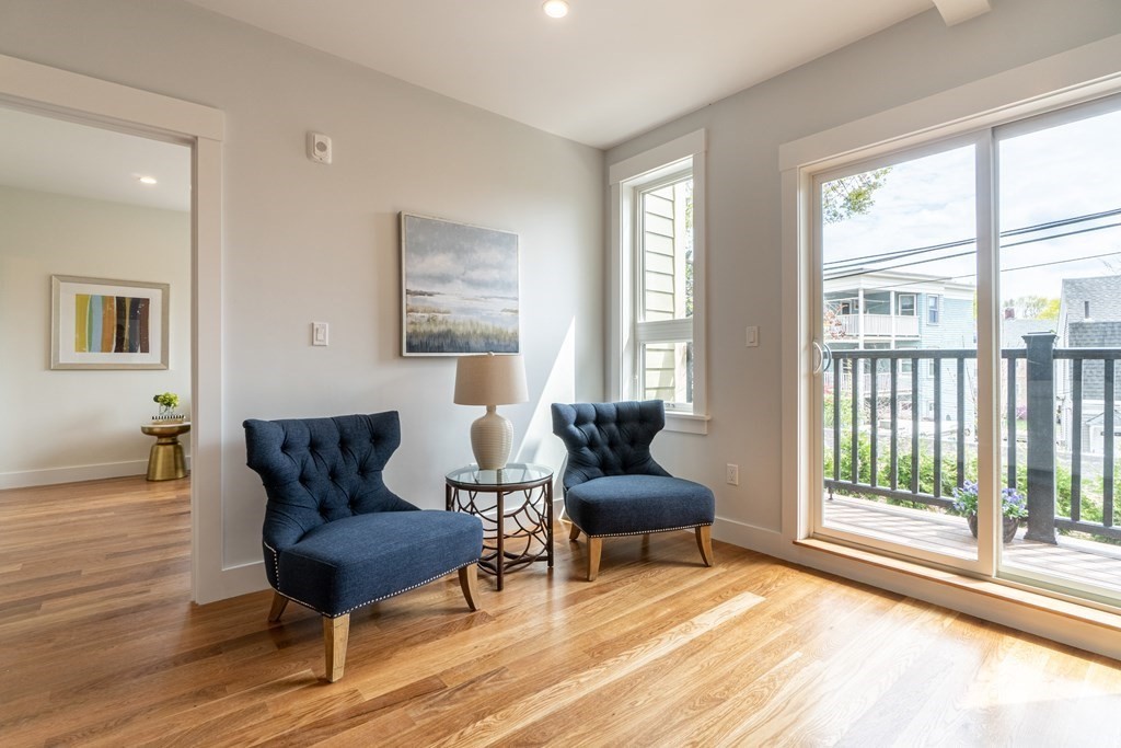 874 South Street, Unit 5 Boston, MA 02131 - Photo 14 of 19 a living room with furniture and a window