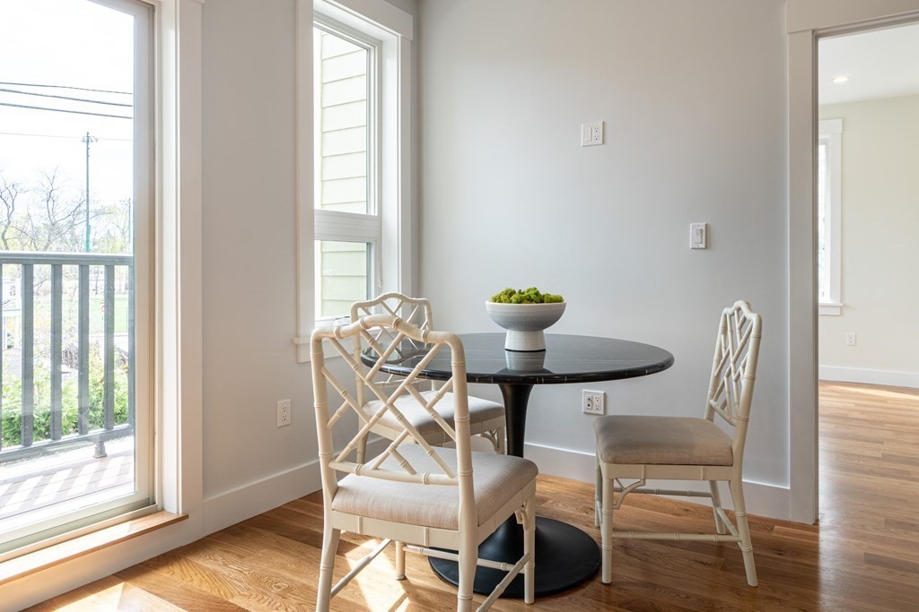 874 South Street, Unit 5 Boston, MA 02131 - Photo 15 of 19 a view of a dining room with furniture and wooden floor