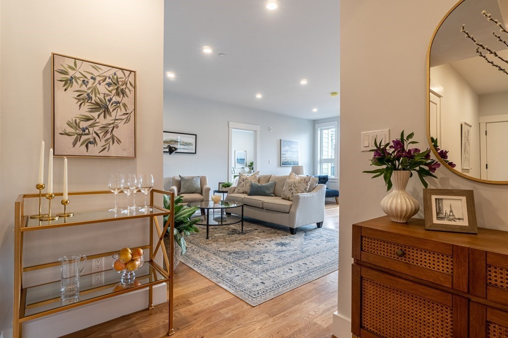 874 South Street, Unit 5 Boston, MA 02131 - Photo 6 of 19 a living room with furniture and flowers