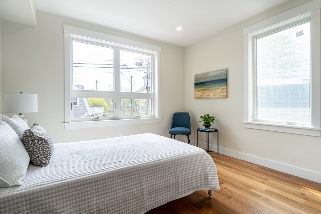 874 South Street, Unit 5 Boston, MA 02131 - Photo 10 of 19 a bedroom with a bed and a window