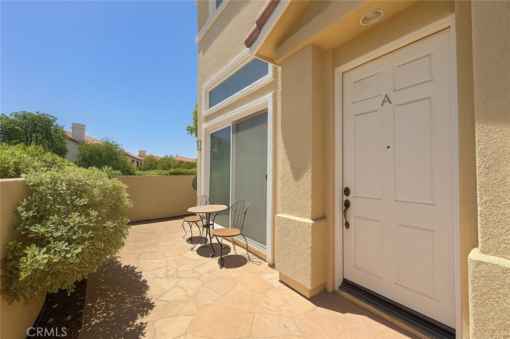 25768 Perlman Place, Unit A Stevenson Ranch, CA 91381 - Photo 18 of 20 a view of a balcony with chair and front door