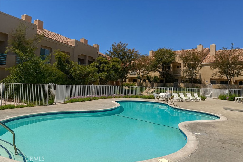 25768 Perlman Place, Unit A Stevenson Ranch, CA 91381 - Photo 19 of 20 a view of a house with a backyard