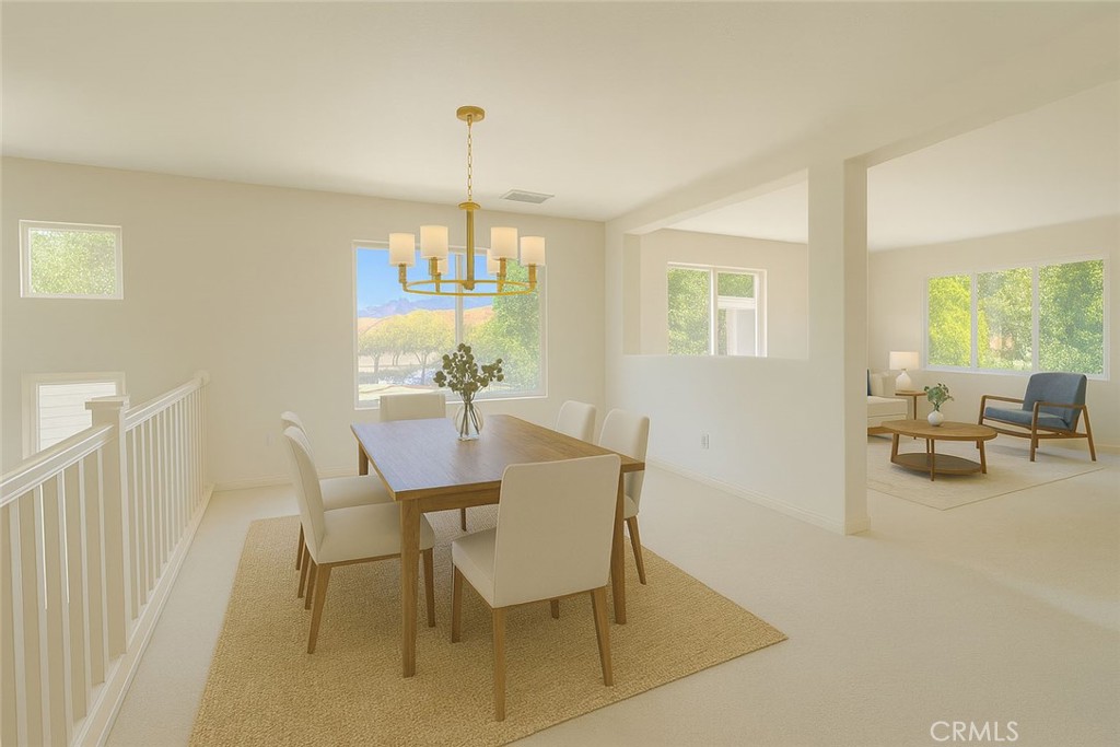 25768 Perlman Place, Unit A Stevenson Ranch, CA 91381 - Photo 6 of 20 a view of a dining room with furniture a chandelier and a large window