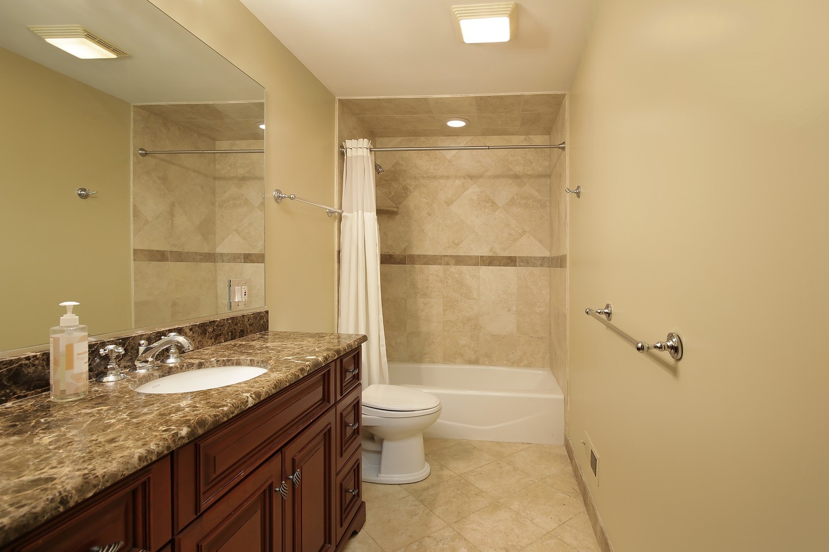 1000 Willow Road Winnetka, IL 60093 - Photo 22 of 26 a bathroom with a granite countertop sink toilet and shower